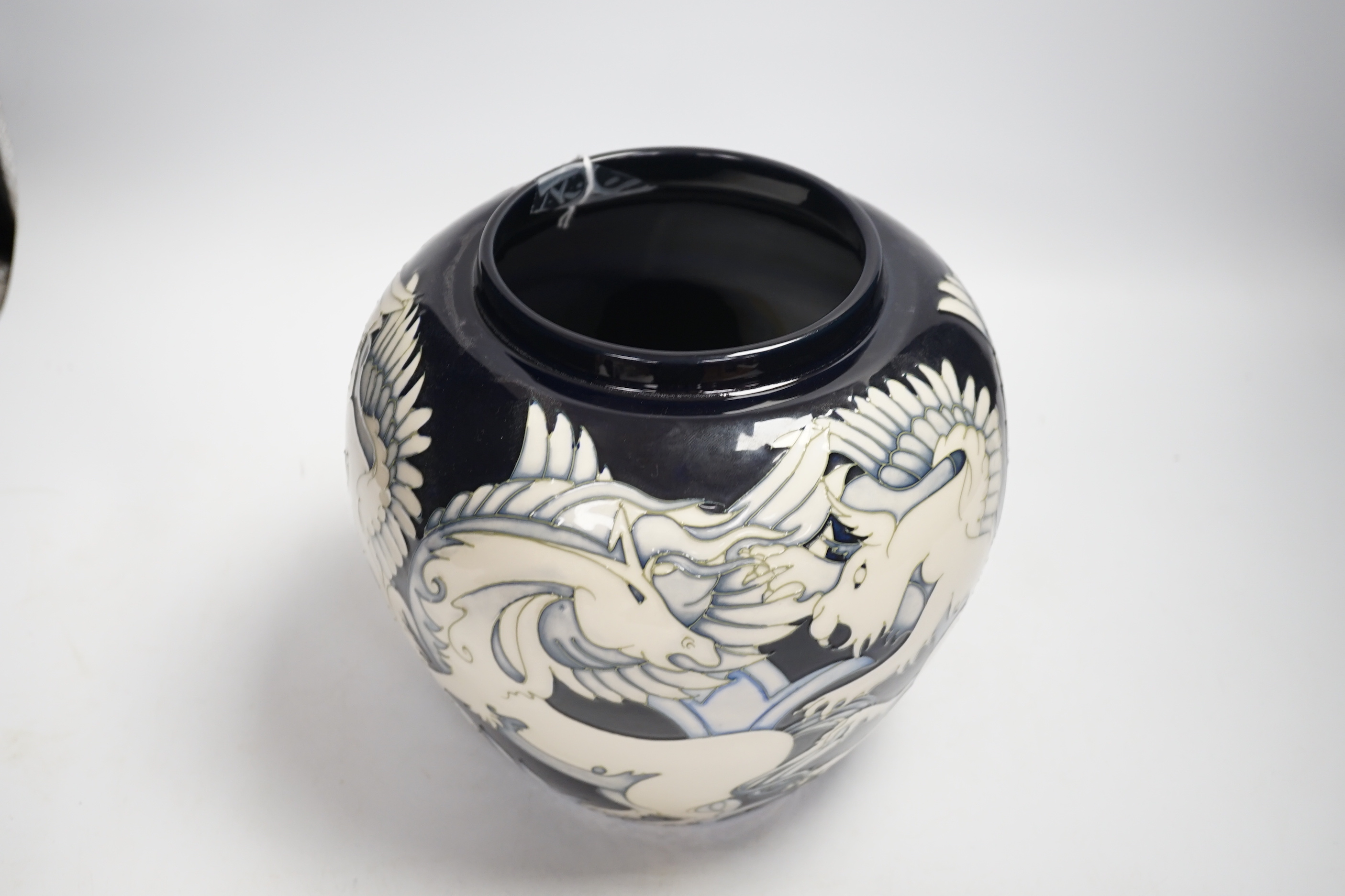 A large Moorcroft ‘Dance of the Griffin’ jar and cover, limited edition no 11/100. Designed by Vicky Lovatt. 24.5cm